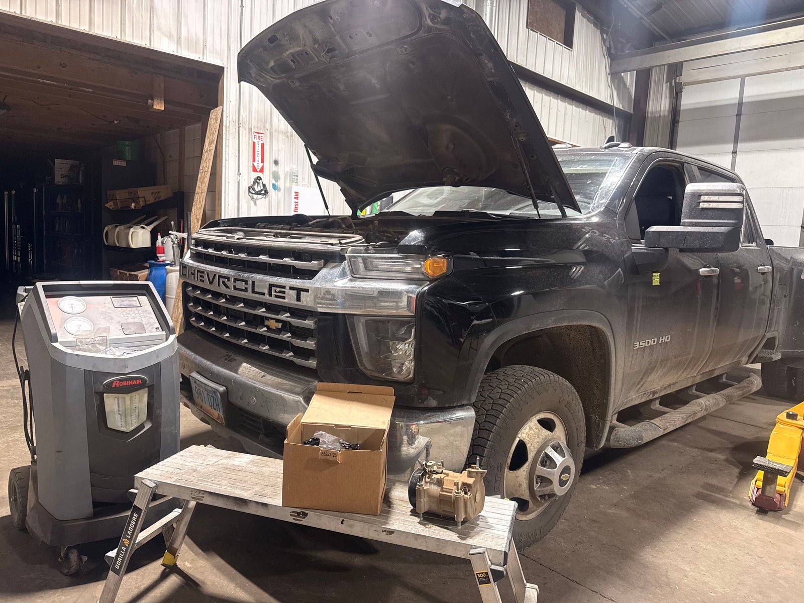 Vehicle repair work inside the Precision Auto Repair shop